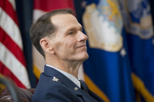 Lt. Gen. Stanley E. Clarke III listens while retired Air Force Chief of Staff Gen. T. Michael Moseley reflects on Clarke’s career during the former’s retirement ceremony at the Air National Guard Readiness Center, Joint Base Andrews, Maryland, Dec. 18, 2015. Clarke is the 15th director of the Air National Guard.  (National Guard photo by Master Sgt Marvin R. Preston)