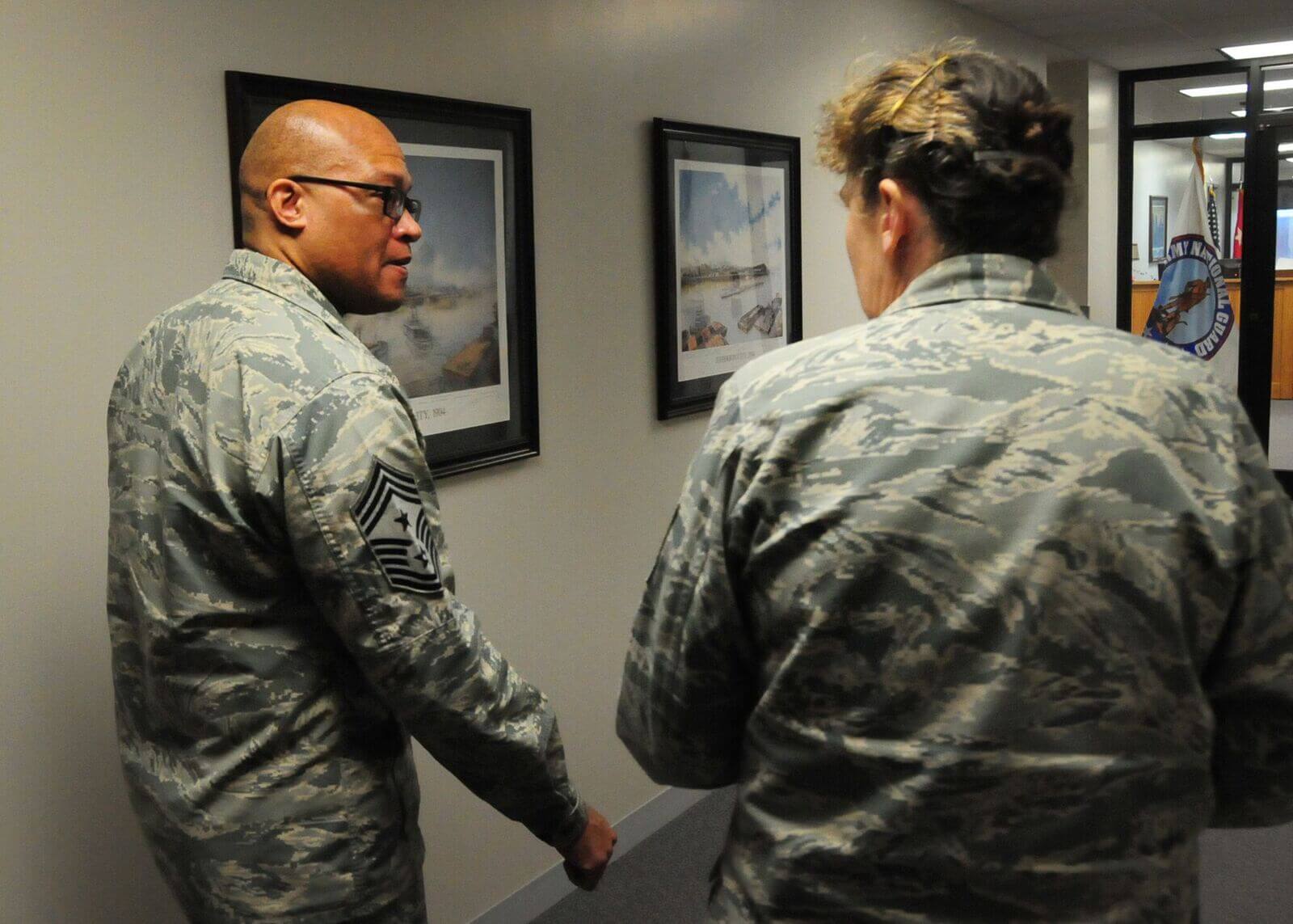 Missouri Air National Guard Command Chief Master Sgt. Joseph E. Hamlett, Ph.D., talks with Senior Master Sgt. Paula J. Runyon, a personnel specialist with the Missouri Air National Guard, at the Ike Skelton National Guard Training Site, in Jefferson City, Mo. Hamlett holds the highest enlisted position in the Missouri Air National Guard and advises the Adjutant General of Missouri on all matters affecting the readiness, training and professional development of all enlisted members of the Missouri Air National Guard.