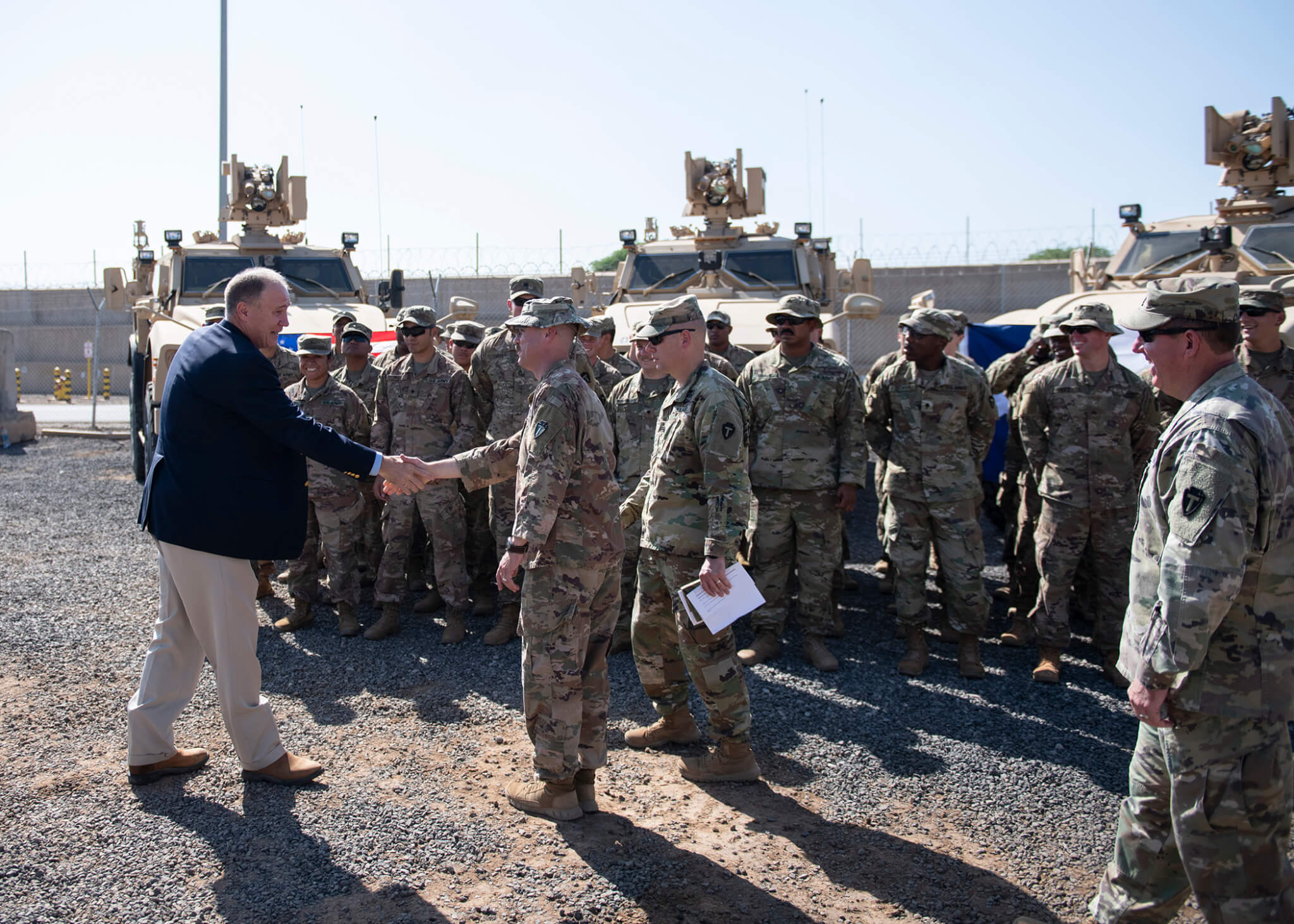 Kelly, a co-sponsor of the bill, greets Task Force Alamo of the Texas Army National Guard during a congressional delegation visit in Djibouti. Photo by Tech. Sgt. Shawn Nickel)