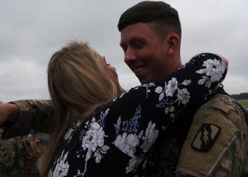 Sgt. Jacob Maxwell, assigned to the 1st Squadron, 98th Cavalry Regiment, hugs his wife Colby at the 172d Airlift Wing in Flowood, Miss., April 6, 2019. Maxwell was deployed to Kuwait with Mississippi's 155th Armored Brigade Combat Team in support of Operation Spartan Shield. The unit was mobilized on active duty for approximately one year. (U.S. Army Nathoto by Spc. Victoria Miller)