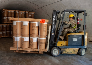 Pvt. Veronica Rodriguez stores munitions in an Anniston Munitions Center igloo. The 266th Ordnance Company out of Puerto Rico transports and stores munitions in the Anniston Munitions Center's igloos at Anniston Army Depot as part of Patriot Bandoleer 2019, a training mission enhancing the readiness of Army forces by pairing Reserve Component units with munitions centers which can utilize their transportation and ordnance experience. Photo by Jennifer Bacchus.