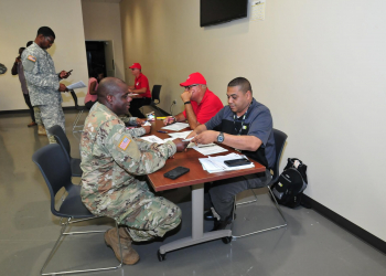 Chief Warrant Officer 2 Joshua Maillard, Virgin Islands National Guard, meets with a representative of the Disabled American Veterans organization during a veterans' benefit and information and claims clinic at the Estate Bethlehem Military Compound on St. Croix. Photo by Sgt. Juanita Philip.