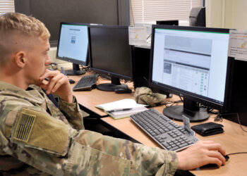 A soldier reviews the Army Cool website during an Army Credentialing Assistance Program briefing. Photo by Norm Shifflett.