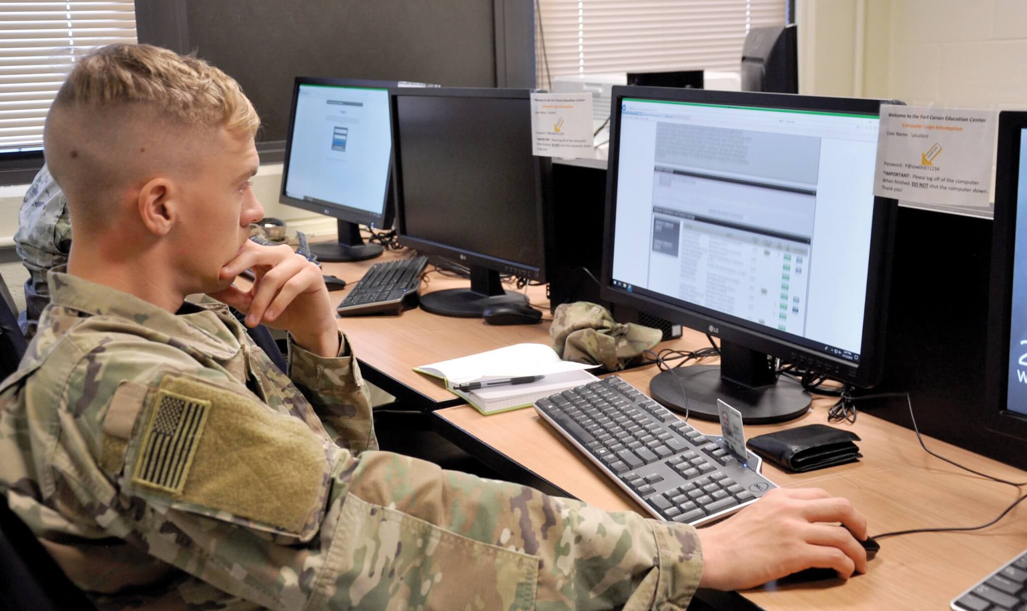 A soldier reviews the Army Cool website during an Army Credentialing Assistance Program briefing. Photo by Norm Shifflett.