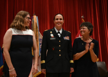 Brig. Gen. Stefanie Horvath (center) is pinned by her wife Christy and her mother Catherine during her promotion ceremony to brigadier general. Photo by Sgt. Sydney Mariette.
