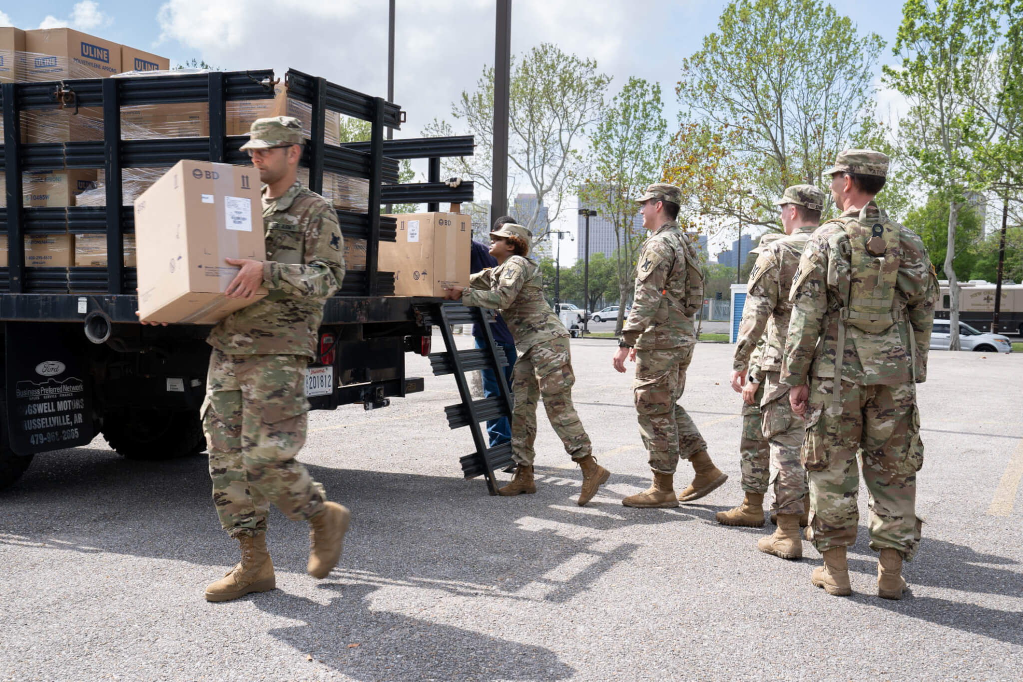 Soldiers and Airmen unload COVID-19 testing supplies and protective
equipment, March 19, 2020. Three testing sites are scheduled to open across
New Orleans and Jefferson Parish. Photo by Staff
Sgt. Josiah Pugh.