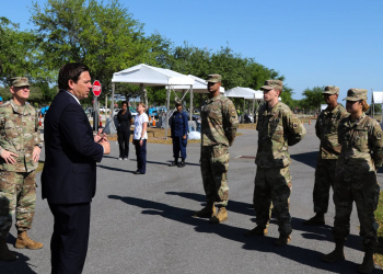 Florida Governor Ron DeSantis, along with the Florida National Guard Adj. Gen. James O. Eifert, thanks a group of soldiers who have been working at the Orange County Convention Center Community Based Testing Site as part of the Florida Army National Guard's Task Force Medical. Photo by Sgt. Spencer Rhodes.