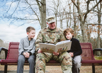 Army Reserve Maj. Kevin Wood reads to his two sons near their home in New Jersey. All photos by John DeFiora Photography.