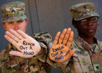 Army Sgt. Rebecca Landry and Spc. Asia Jones highlight the importance of suicide prevention and awareness at Camp Taji, Iraq, in 2019. Photo by Sgt. Roger Jackson.