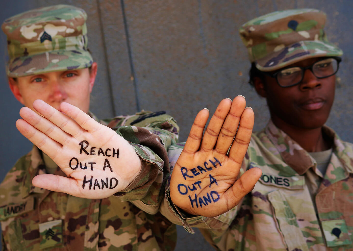 Army Sgt. Rebecca Landry and Spc. Asia Jones highlight the importance of suicide prevention and awareness at Camp Taji, Iraq, in 2019. Photo by Sgt. Roger Jackson.