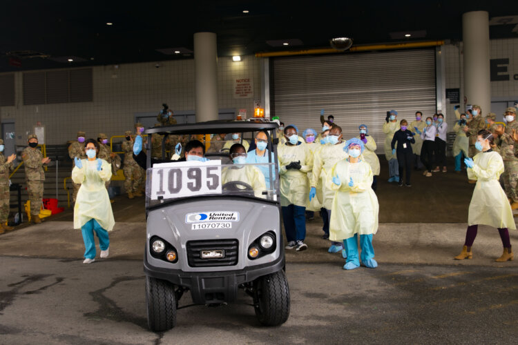 Jorge Rodriguez, the 1,095th and final COVID-19 patient was treated and released at the Javits Medical Station and receives a sendoff by the COVID-19 responders. Photo by 1st Lt. Lauren Warner.