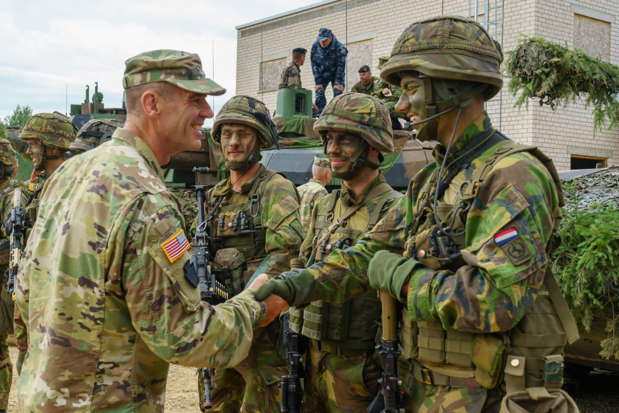 U.S. Army Maj. Gen. John Gronski, deputy commanding general, United States Army Europe, greets Dutch soldiers with the NATO enhanced forward presence battle group during Saber Strike 18 training at Pabrade Training Area, Lithuania on June 11, 2018. Saber Strike is an annual exercise in its eighth iteration that tests participants from 19 countries on their ability to work together and improve each unit’s ability to perform their designated missions. (U.S. Army photo by Sgt. Gregory T. Summers / 22nd Mobile Public Affairs Detachment)