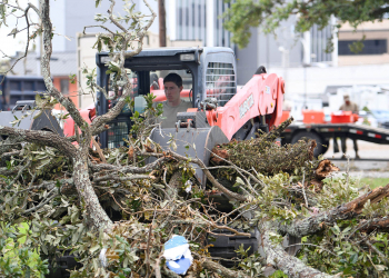 159th Civil Engineering Squadron’s heavy equipment journeyman, Senior Airman William Bommer removes downed tree branches from Hurricane Laura in downtown Lake Charles, La., Aug. 30, 2020.  As part of the 159 CES’s Debris Clearance Package, these Louisiana Air National Guard Airmen were tasked with removing downed trees and rubble for residents to access their homes to assess damages.  (U.S. Air National Guard photo by Senior Master Sgt. Daniel Farrell)