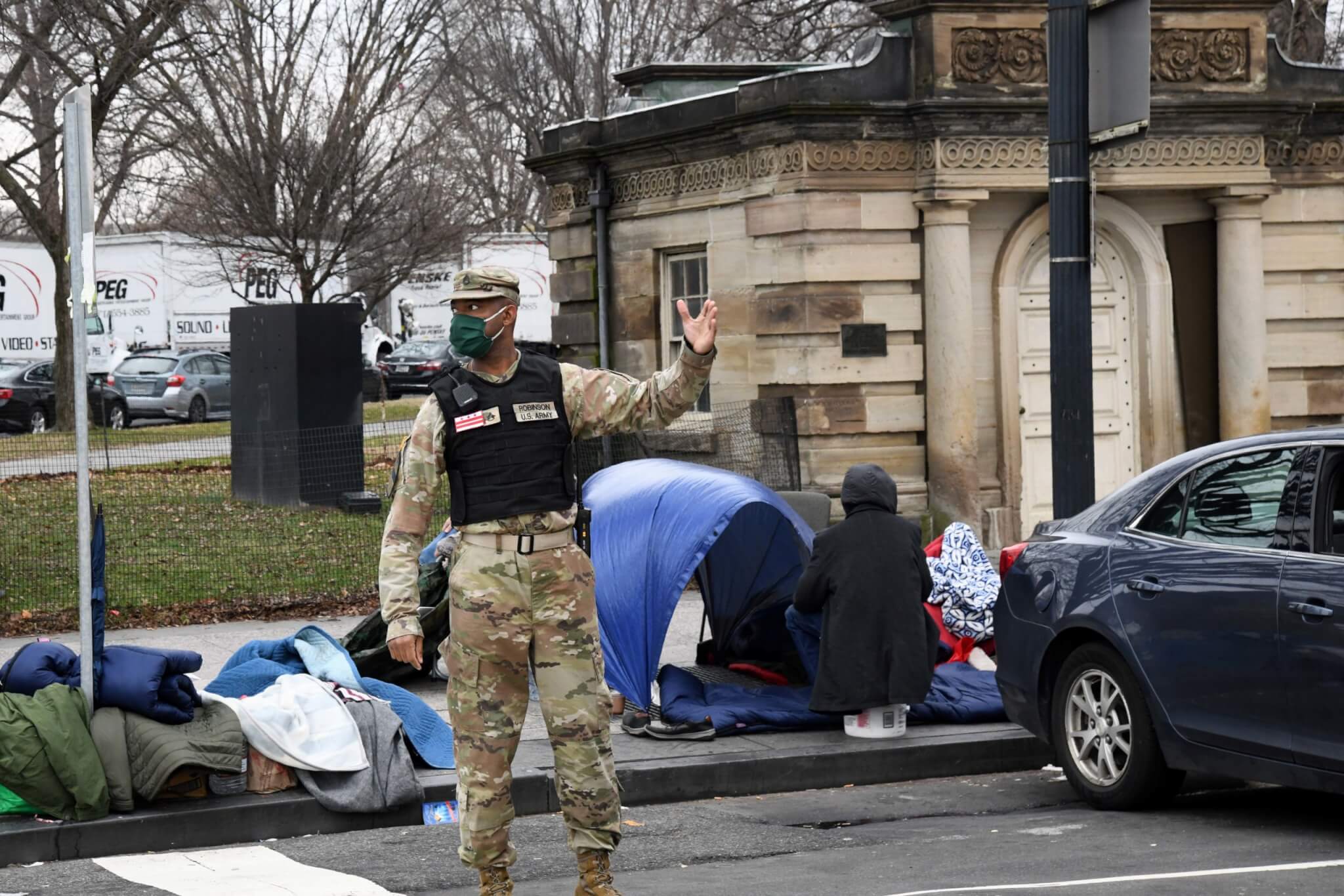 Staff Sgt. Marcus Robinson, mechanic with the 273rd military police company DC national guard, thumbs up a driver in Washington, D.C on January 5, 2021. The District of Columbia National Guard activated several hundred personnel to support the city government during expected demonstrations.