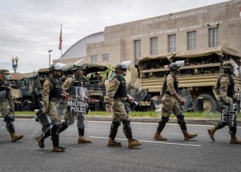 Troops load up into personnel carriers to take them toward the city from the Joint Force Headquarters of the D.C. National Guard on June 2, 2020 in Washington, DC. (Drew Angerer/Getty Images)