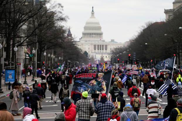 Supporters of President Donald Trump march on Pennsylvania Avenue towards the U.S. Capitol, Wednesday, Jan. 6, 2021, in Washington. (AP Photo/Jacquelyn Martin)