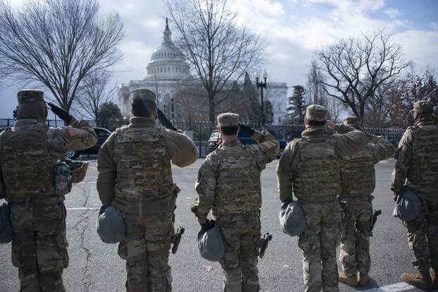 Virginia National Guard soldiers render a salute during the National Anthem at the 59th Presidential Inauguration Jan. 20, 2021, in Washington, D.C (U.S. Army National Guard/Staff Sgt. Lisa M. Sadler)