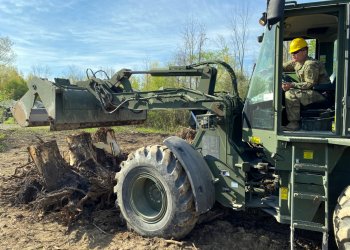 A New York Army National Guard soldier assigned to the 152nd Engineer Company uses a dozer to clear tree trunks and debris during construction operations at the National Guard Youngstown Local Training Area. U.S. Army National Guard photo by Lt. Col. Al Phillips.