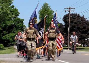 Michael Gomolka, president of Project 33, leads participants of his organization's annual Memorial Day run.