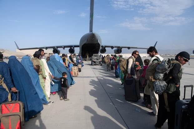 U.S. Air Force loadmasters and pilots assigned to the 816th Expeditionary Airlift Squadron, load passengers aboard a U.S. Air Force C-17 Globemaster III in support of the Afghanistan evacuation at Hamid Karzai International Airport (HKIA), Afghanistan, Aug. 24, 2021. (Master Sgt. Donald R. Allen/U.S. Air Force photo)