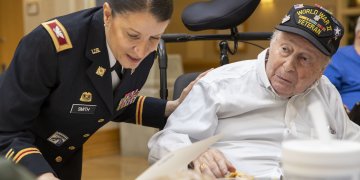 Then-Col. Isabel Smith, chief of staff of the 53rd Troop Command, visits the New York State Veterans Home in Montrose, New York, on June 6, 2019, as part of an effort organized by Governor Andrew M. Cuomo to salute World War II veterans on the 75th anniversary of D-Day.