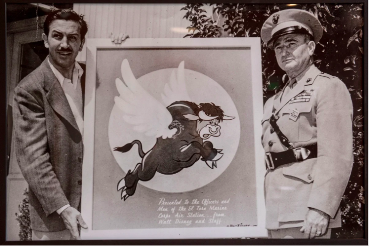 Walt Disney presents the flying bull logo to MCAS El Toro CO Col. William Fox in 1943 (USMC)