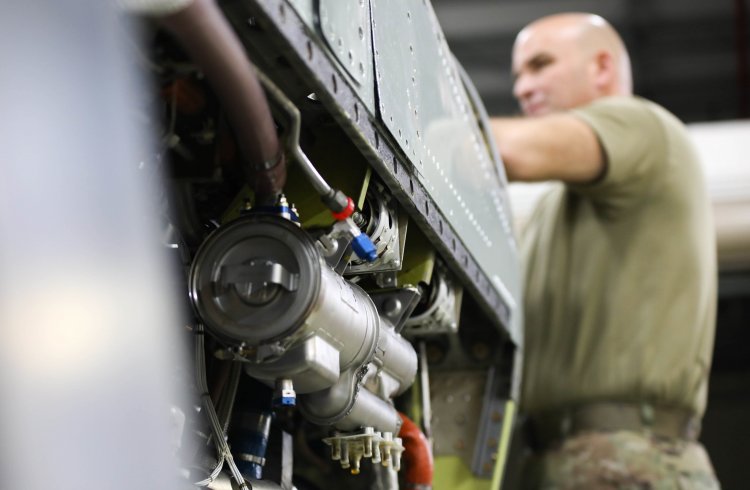 U.S. Air National Guard Staff. Sgt. Jason Candido, a propulsion specialist at the 109th Airlift Wing, performs maintenance on a 3.5 turbo engine. Photo by Staff Sgt. Madison Daquelente