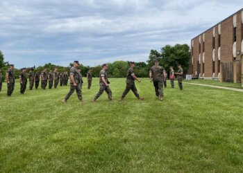 Marines of Marine Advisor Company A, Force Headquarters Group, take part in a military awards ceremony on Joint Base Anacostia-Bolling in Washington, D.C., May 5, 2023. One of the four Marines being recognized thwarted a transnational criminal human trafficking organization while drilling with his unit that weekend by identifying the signs of exploitation and ultimately freeing a handful of young teenage women with the Virginia Human Trafficking Task Force. Provided by MCAC-A