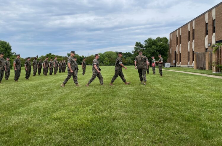Marines of Marine Advisor Company A, Force Headquarters Group, take part in a military awards ceremony on Joint Base Anacostia-Bolling in Washington, D.C., May 5, 2023. One of the four Marines being recognized thwarted a transnational criminal human trafficking organization while drilling with his unit that weekend by identifying the signs of exploitation and ultimately freeing a handful of young teenage women with the Virginia Human Trafficking Task Force. Provided by MCAC-A