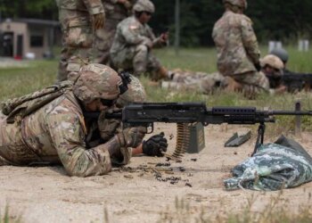 U.S. Army Reserve soldier fires a M240B automatic machine gun during a live fire range qualification on Joint Base McGuire-Dix-Lakehurst, New Jersey, July 18, 2023. Photo by Spc. Britton Spencer