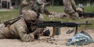 U.S. Army Reserve soldier fires a M240B automatic machine gun during a live fire range qualification on Joint Base McGuire-Dix-Lakehurst, New Jersey, July 18, 2023. Photo by Spc. Britton Spencer