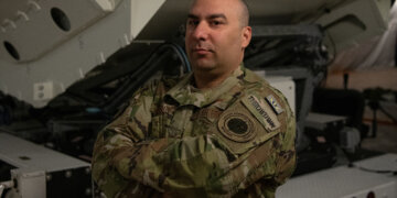 Air Force Master Sgt. Ryan Colon, pictured here as a technical sergeant with the Florida Air National Guard’s 114th Electromagnetic Warfare Squadron, poses in front of space-based equipment at Patrick Air Force Base, Florida, June 29, 2022. Colon is the first enlisted Airman in the Air National Guard to graduate from the Space Warfighter Advanced Instructor Course at the U.S. Air Force Weapons School in Nellis Air Force Base, Nevada. (U.S. National Guard photo by Orion Oettel)