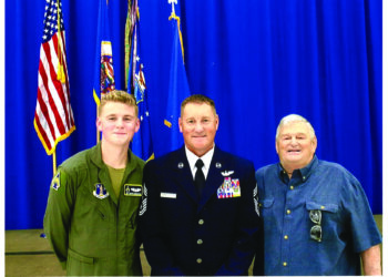 Air Force Chief Master Sgt. Richard Schumacher, center, Airman 1st Class Cooper Schumacher, left, and retired Chief Master Sgt. Richard Schumacher. Photo by Master Sgt. Amy M. Lovgren