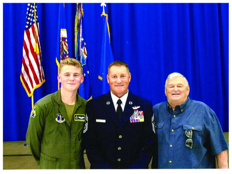 Air Force Chief Master Sgt. Richard Schumacher, center, Airman 1st Class Cooper Schumacher, left, and retired Chief Master Sgt. Richard Schumacher. Photo by Master Sgt. Amy M. Lovgren