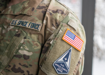 Staff Sgt. David Diehl II, 436th Communications Squadron NCOIC of wing cybersecurity, displays his new Space Force tapes and service branch patch at Dover Air Force Base in 2021. Diehl was one of three members of Team Dover accepted into the Space Force. Photo by Mauricio Campino