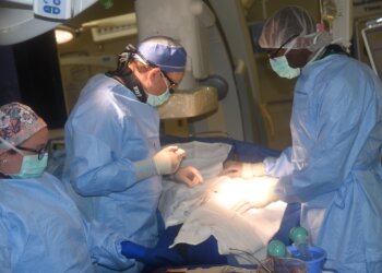 Surgery is performed in a hybrid operating room at WRNMMC. Photo by Alpha Kamara