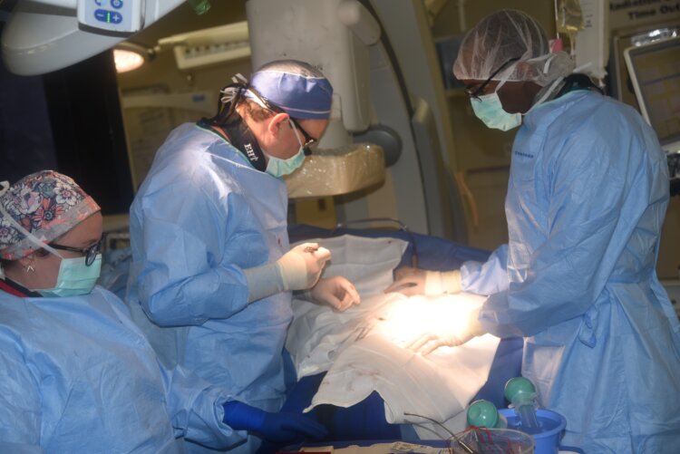 Surgery is performed in a hybrid operating room at WRNMMC. Photo by Alpha Kamara