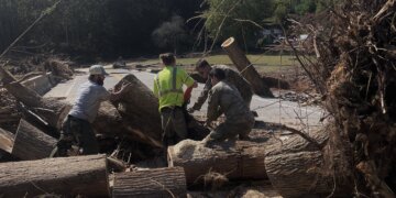 Army Reserve soldiers from the 357th Engineer Company out of Asheville, North Carolina, help the emergency response team clear road debris in support of citizens affected by Hurricane Helene in Burnsville, North Carolina (Yancey County).