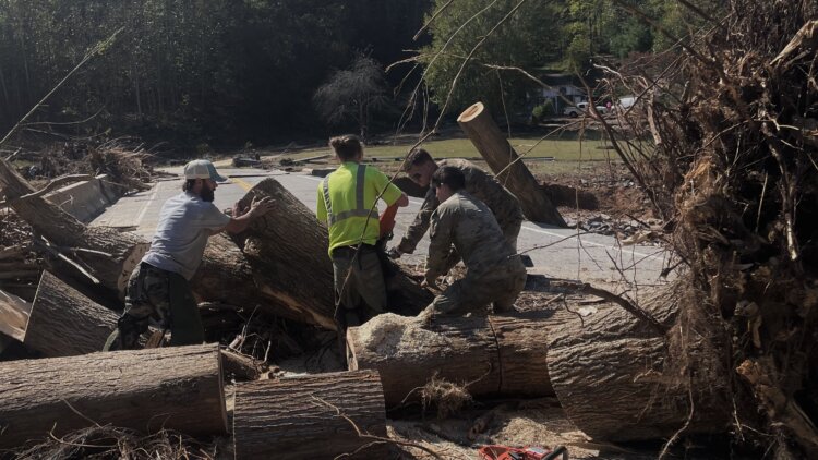 Army Reserve soldiers from the 357th Engineer Company out of Asheville, North Carolina, help the emergency response team clear road debris in support of citizens affected by Hurricane Helene in Burnsville, North Carolina (Yancey County).