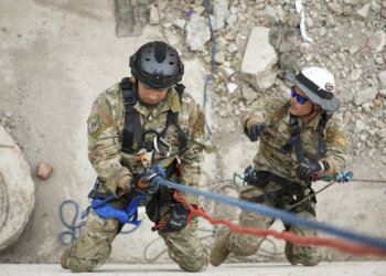 U.S. Air Force Tech Sgt. Frankie Bolaños, left, lowers himself on the line to simulate the rescue of Tech Sgt. Daniel Kolk, both fire contingency instructors with the Pacific Air Force, while demonstrating high-angle rescue techniques during the Field Training Exercise at Gobi Wolf 2024 in Choibalsan, Mongolia, May 9. The teams showcased best practices in safely extracting trapped individuals from precarious situations. Gobi Wolf 24 is part of the Pacific Resilience Disaster Response Exercise and Exchange program, which focuses on interagency coordination and foreign humanitarian assistance and is coordinated by the Mongolian National Emergency Management Agency and U.S. Army Pacific. (U.S. Army photo by Capt. Balinda O’Neal)