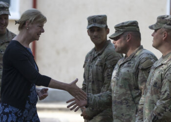 Army Sgt. 1st Class Brandon Kramer assigned to 101st Airborne Division (Air Assault) greets U.S. Sen. Tammy Baldwin of Wisconsin during a visit to Mihail Kogalniceanu Air Base, Romania, July 7, 2022. The delegation traveled to Romania to engage with U.S. forces, gain a better understanding of U.S. strategic efforts in Europe and engage with Soldiers from Wisconsin. (U.S. Army photo by Spc. Dean Johnson, 5th Mobile Public Affairs Detachment)