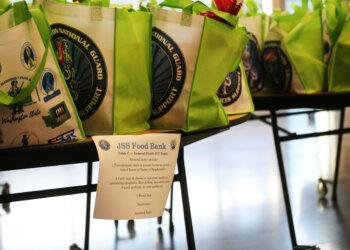 Bags with food sit on a table at the Pierce County Readiness Center, Camp Murray, Wash., Oct. 30, 2025. (U.S. National Guard photo by Joseph Siemandel)