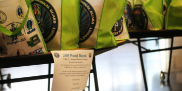 Bags with food sit on a table at the Pierce County Readiness Center, Camp Murray, Wash., Oct. 30, 2025. (U.S. National Guard photo by Joseph Siemandel)