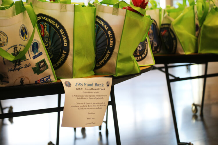 Bags with food sit on a table at the Pierce County Readiness Center, Camp Murray, Wash., Oct. 30, 2025. (U.S. National Guard photo by Joseph Siemandel)