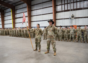 Florida Army National Guard Soldiers with 1st Squadron, 153rd Cavalry Regiment “Darkhorse” stand in formation during a departure ceremony in Panama City, Jan. 4, 2026. Major Gen. John D. Haas, The Adjutant General of Florida, and Maj. Gen. Robert G. Curruthers, Assistant Adjutant General-Army and the commander, Florida Army National Guard, was among those attending the event, signifying the unit’s deployment in support of global security objectives. Members of the Darkhorse specialize in reconnaissance and security operations. (U.S. Air Force photo by Staff Sgt. N.W. Huertas)