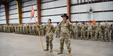 Florida Army National Guard Soldiers with 1st Squadron, 153rd Cavalry Regiment “Darkhorse” stand in formation during a departure ceremony in Panama City, Jan. 4, 2026. Major Gen. John D. Haas, The Adjutant General of Florida, and Maj. Gen. Robert G. Curruthers, Assistant Adjutant General-Army and the commander, Florida Army National Guard, was among those attending the event, signifying the unit’s deployment in support of global security objectives. Members of the Darkhorse specialize in reconnaissance and security operations. (U.S. Air Force photo by Staff Sgt. N.W. Huertas)