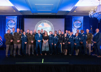 National Guard members stand alongside law enforcement and community partners during the High Intensity Drug Trafficking Area, or HIDTA, National Awards Ceremony hosted by the White House Office of National Drug Control Policy, April 2, 2026. The ceremony recognized 10 award-winning investigations supported by federal, state, local and tribal agencies working to disrupt drug trafficking networks across the United States. Courtesy photo by National HIDTA Program.