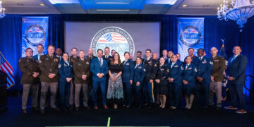 National Guard members stand alongside law enforcement and community partners during the High Intensity Drug Trafficking Area, or HIDTA, National Awards Ceremony hosted by the White House Office of National Drug Control Policy, April 2, 2026. The ceremony recognized 10 award-winning investigations supported by federal, state, local and tribal agencies working to disrupt drug trafficking networks across the United States. Courtesy photo by National HIDTA Program.