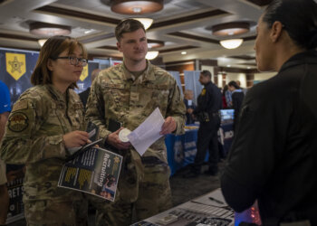 Service members speak with potential employers during a career fair at MacDill Air Force Base, Florida, April 13, 2023. The event provided opportunities for active duty, guard, reserve, Department of Defense civilians and spouses to speak with more than 70 local and international employers. (U.S. Air Force photo by Senior Airman Lauren Cobin)