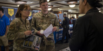 Service members speak with potential employers during a career fair at MacDill Air Force Base, Florida, April 13, 2023. The event provided opportunities for active duty, guard, reserve, Department of Defense civilians and spouses to speak with more than 70 local and international employers. (U.S. Air Force photo by Senior Airman Lauren Cobin)